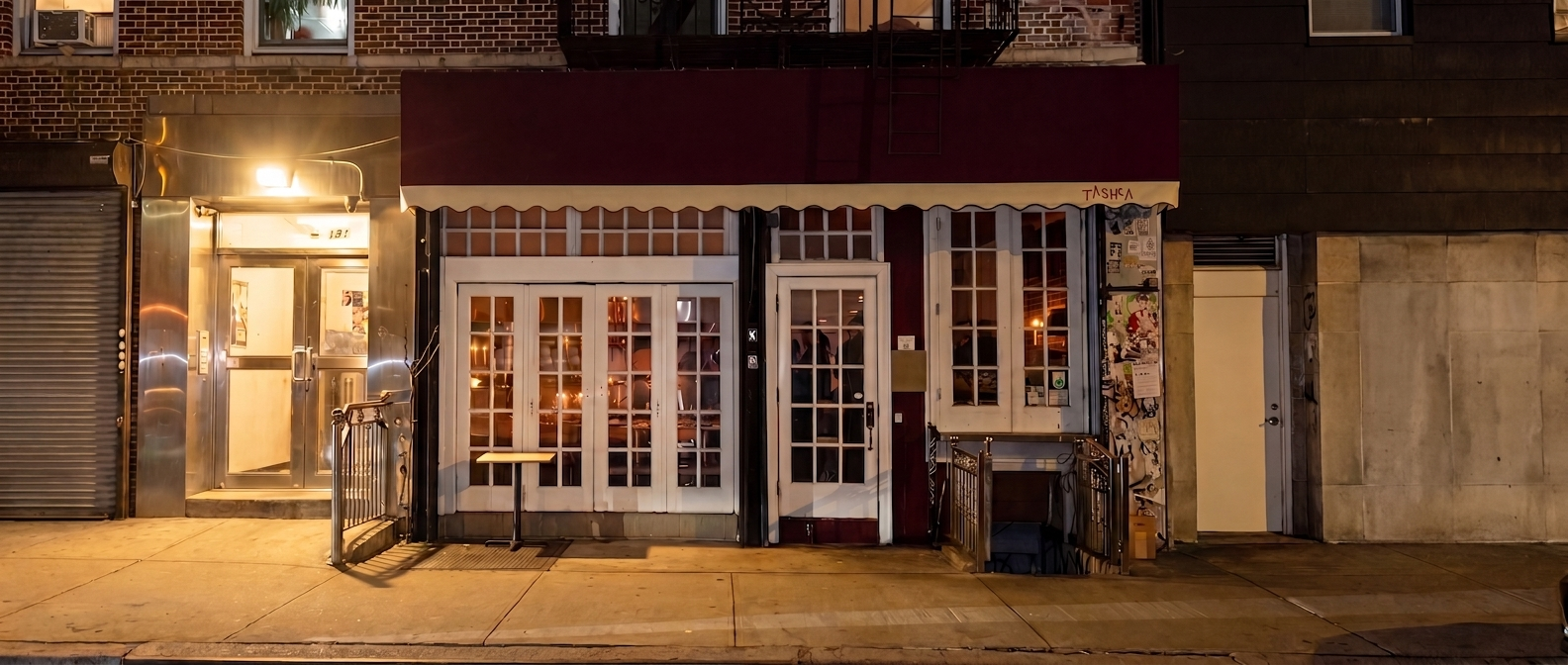 TASHCA storefront at night